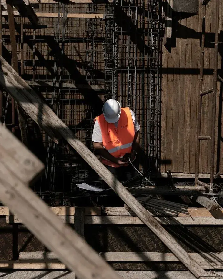 Site engineer checking column reinforcement inside the shuttering